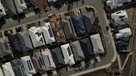 top down view of houses roofs with solar panels, perth city, western australia