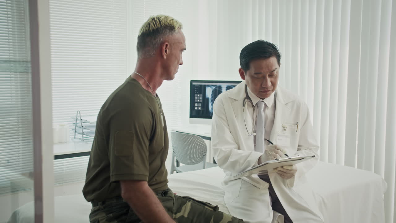 Doctor consulting with patient about x-ray results