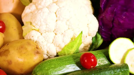 assorted vegetables displayed on a wooden background