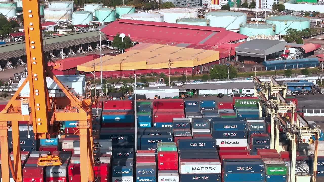 Cargo containers and warehouses in Bangkok shown from above at daytime