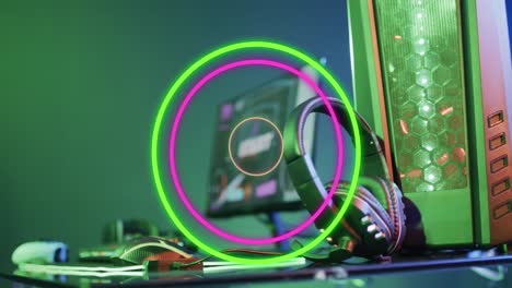 animation of neon circles over video game computer equipment