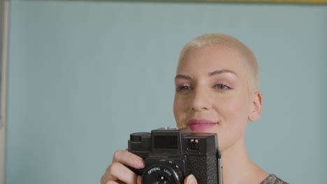 female photographer poses with vintage camera 08