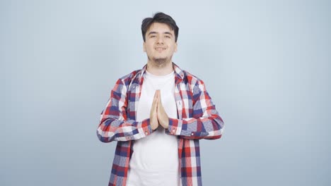 Man-meditating-looking-at-camera.