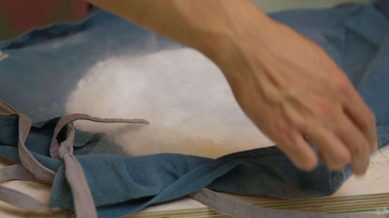 Unpacking dry icecream compound powder from cloth