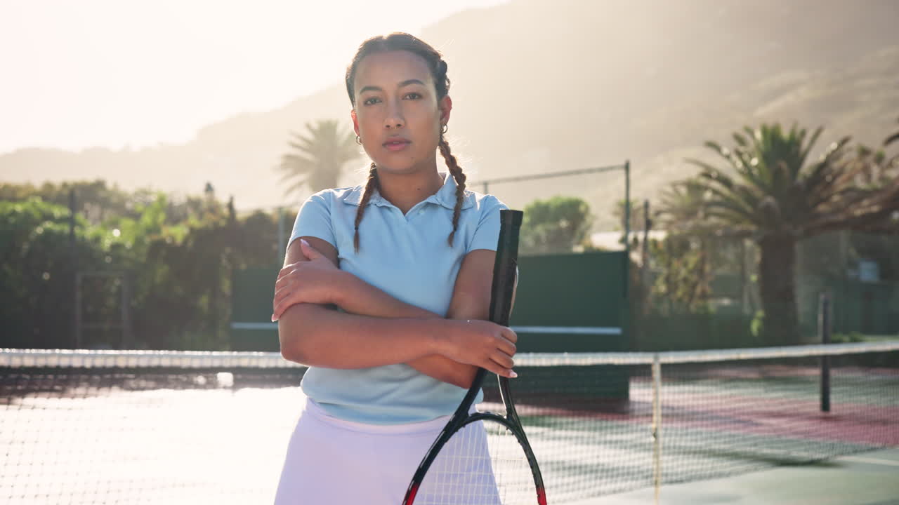 Female tennis player with racket on court