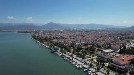 drone shot of fethiye city with walking promenade and cars in the turkish riviera