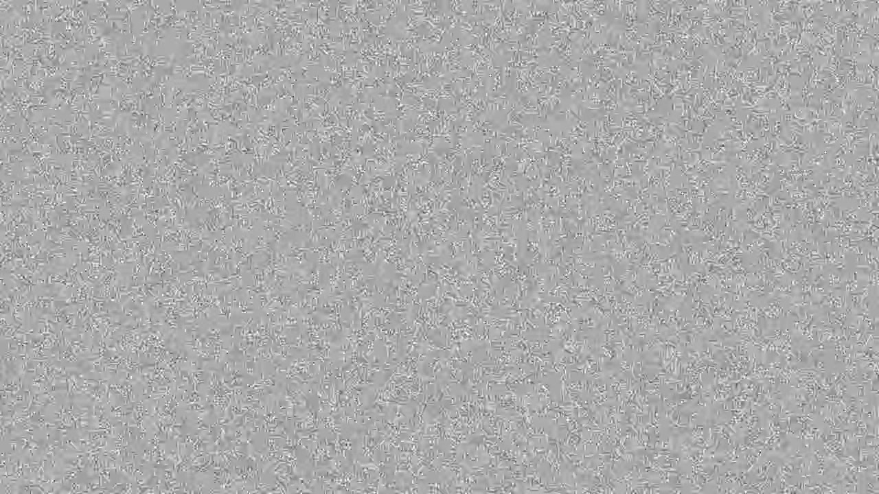 Heavy vintage 8mm film grain noise texture overlay on black background seamless loop