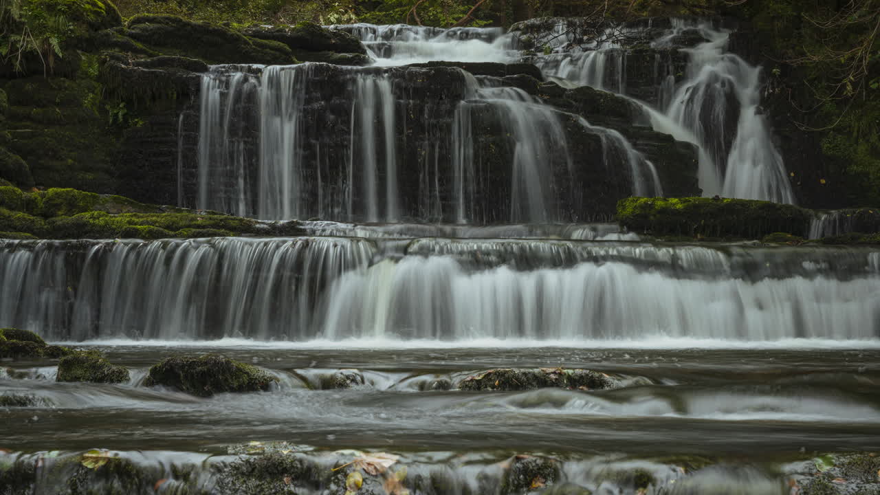 Time lapse of forest waterfall in rural landscape during autumn in Ireland