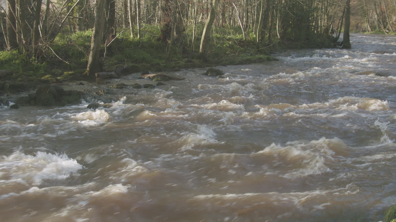 North York Moors, River Esk in full flow flood, slow pan, Late Summer, Autumn time, Slow motion - Clip 11