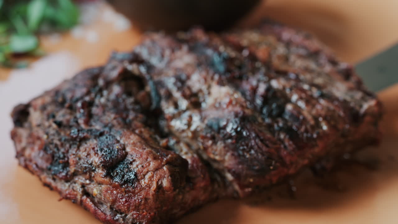 Close up of a Sirloin Steak with Barbecue Sauce and micro-plants on the side
