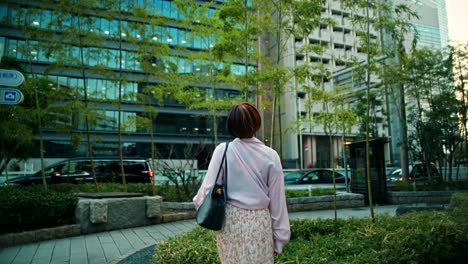 woman walking in urban japanese cityscape