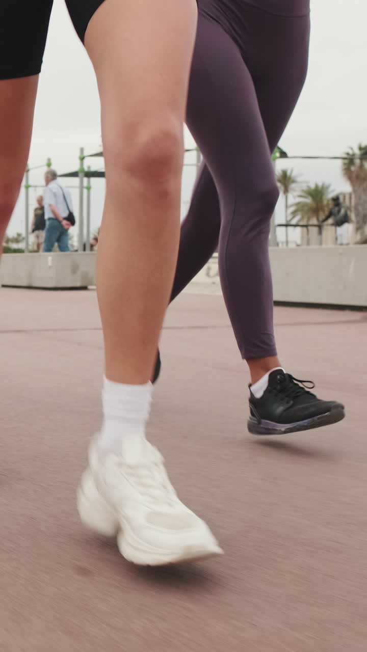 Friends Jogging by the Sea