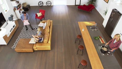 Overhead-Shot-Of-Parents-Having-Cushion-Fight-With-Children