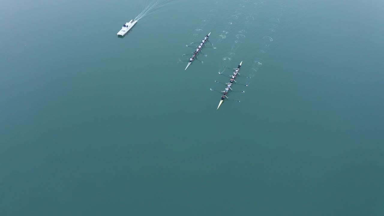 Kayaks making good time in unison while training on a foggy day in the bay.