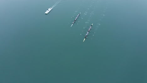 kayaks making good time in unison while training on a foggy day in the bay.