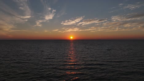 Aerial-reverse-view-of-Sunset-over-Mobile-Bay-near-the-Fairhope-yacht-Club