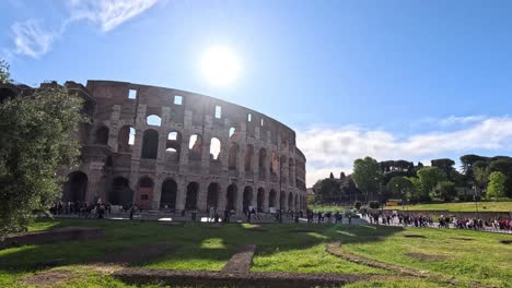 tourists exploring the historic colosseum under the sun