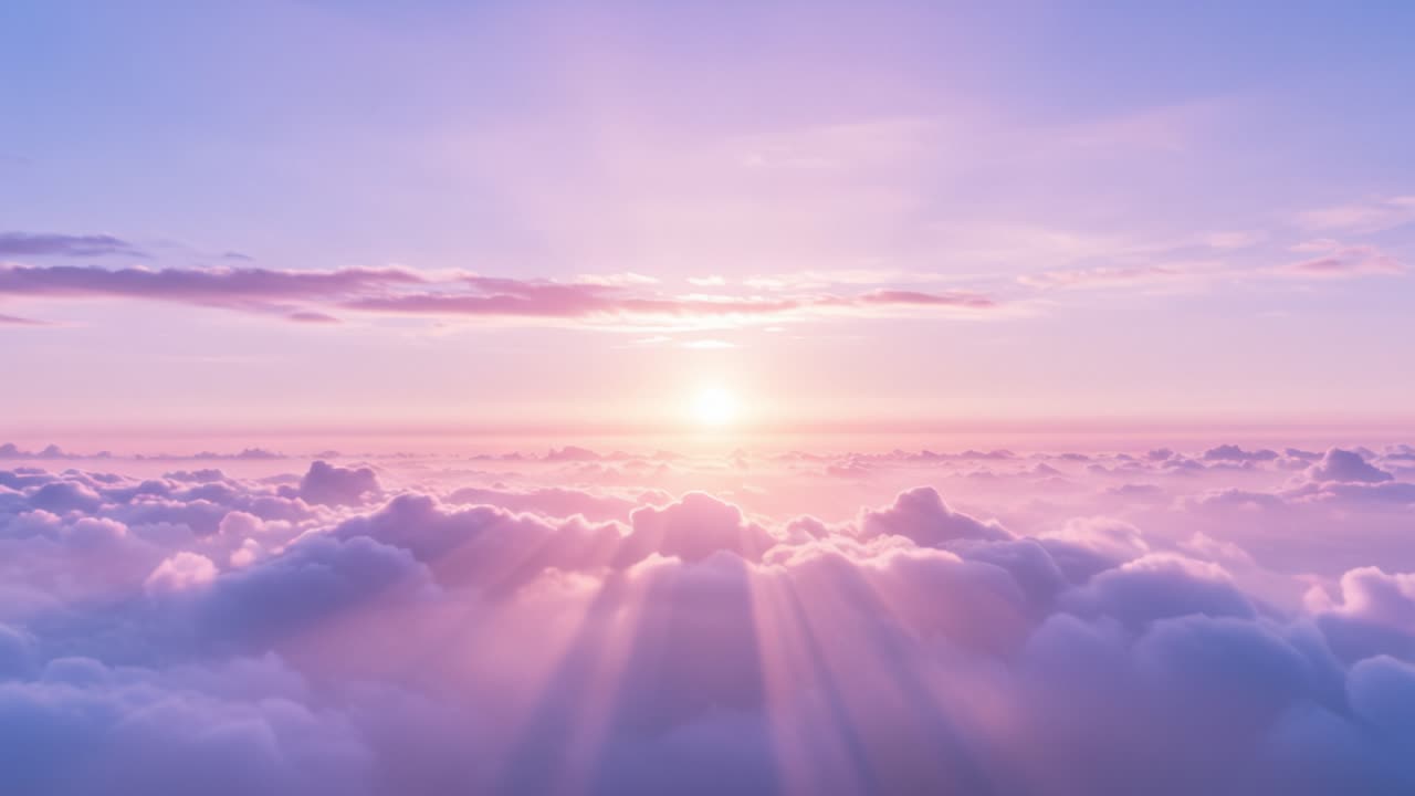 A stunning display of nature unfolds as the sun rises over a blanket of fluffy clouds, casting warm hues across the sky. The soft pinks and oranges create a calm atmosphere, perfect for reflection and peace. Viewers can witness the transition from night to day, as the light gradually illuminates the