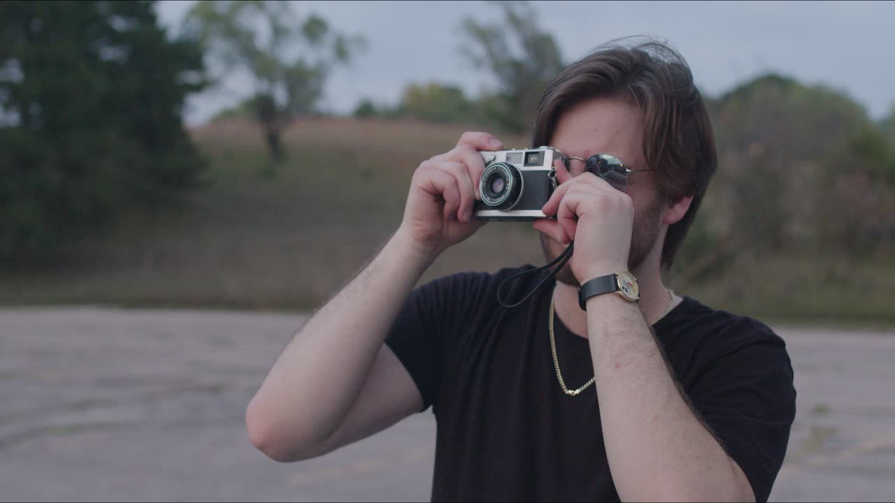 Close up of man talking photos in nature