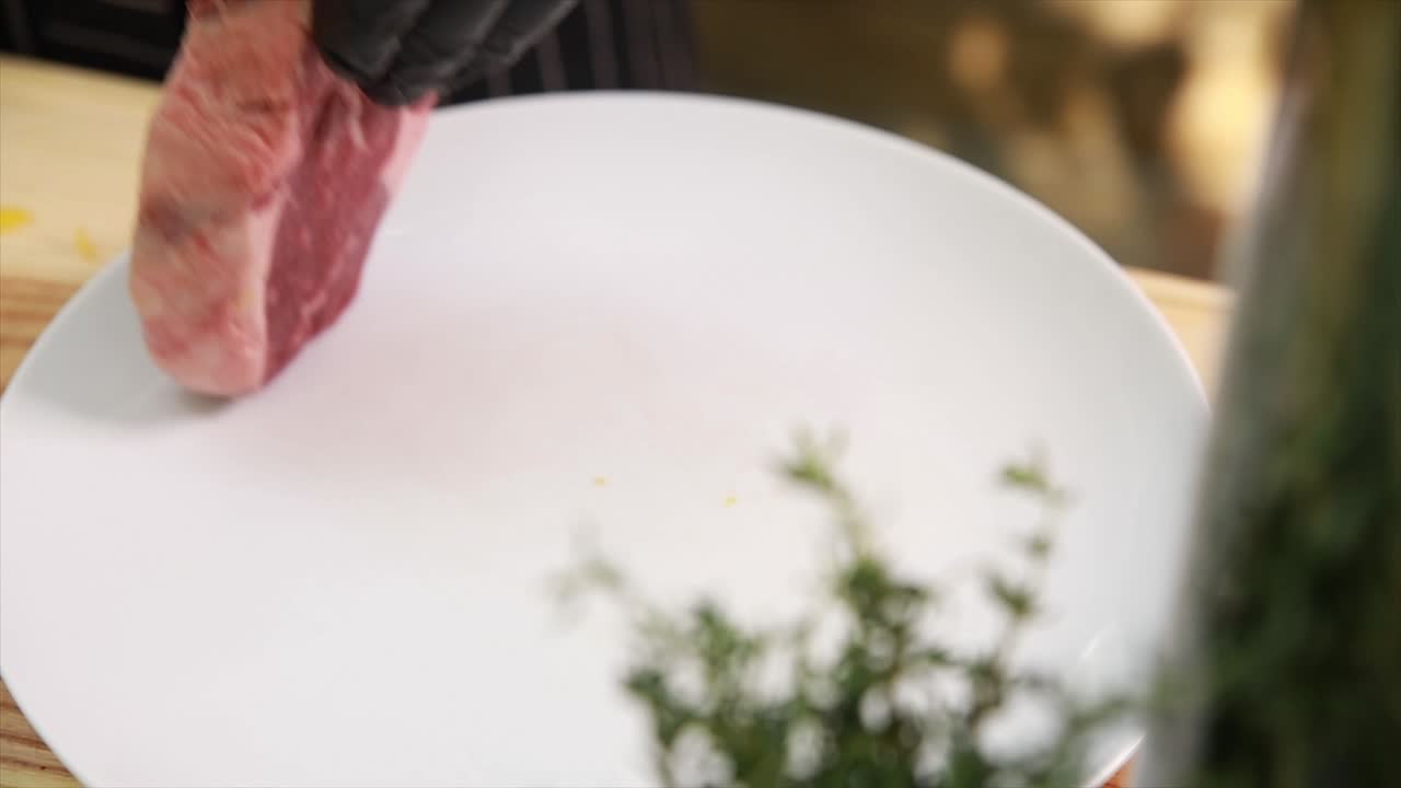 Raw Rib-Eye Steak on a Plate