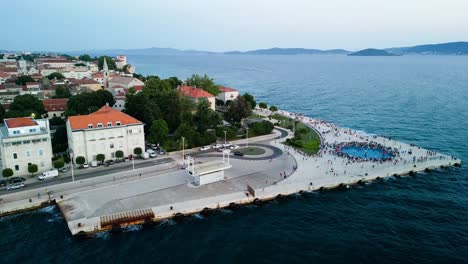 aerial over the zadar sunset monument sea coast, also known as the monument to the sun, an captivating and innovative art installation located in the beautiful croatian city of zadar
