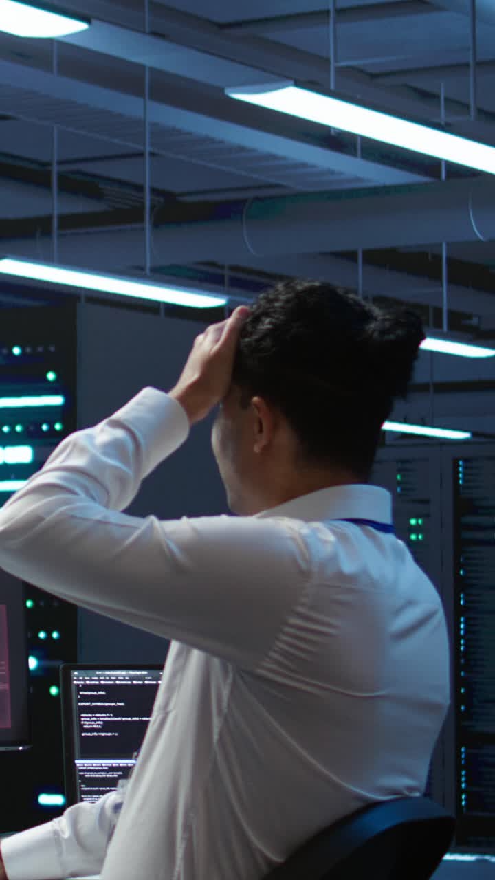 IT Professional Reacts to System Hacked Alert in Data Center