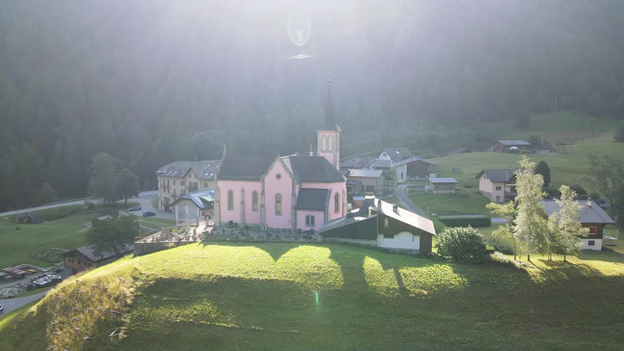 Pink Church in a Charming Alpine Village in Morning Light