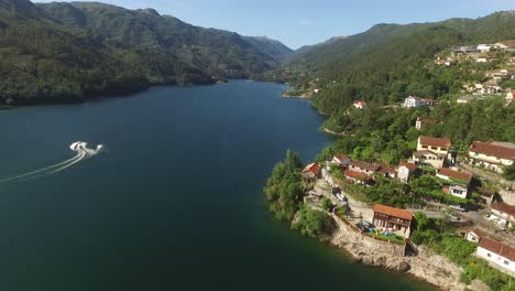 speed boat on river of national natural park of geres on portugal aerial view