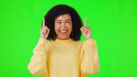 Happy-woman,-pointing-up-and-green-screen