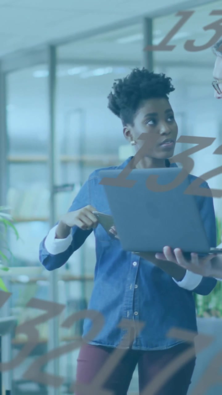 Business colleagues discussing work with numbers animation over office background