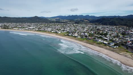 Idyllic-Seascape-Of-Whangamata-Beach-In-Coromandel-Peninsula,-New-Zealand---Aerial-Drone-Shot