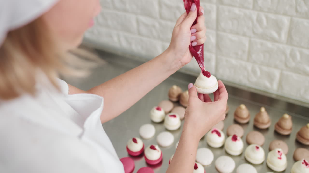 Woman Pastry Chef Decorating Macarons