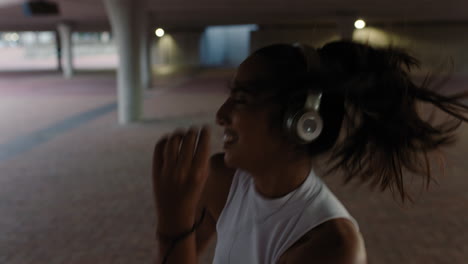 dancing woman young street dancer wearing headphones enjoying listening to hip hop music performing freestyle dance moves in city