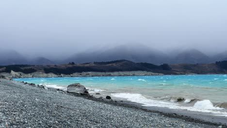 gloomy, stormy conditions on lake pukaki's south shore