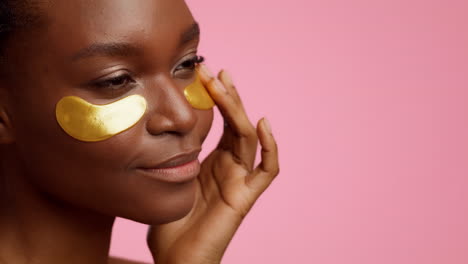 woman with gold eye patches