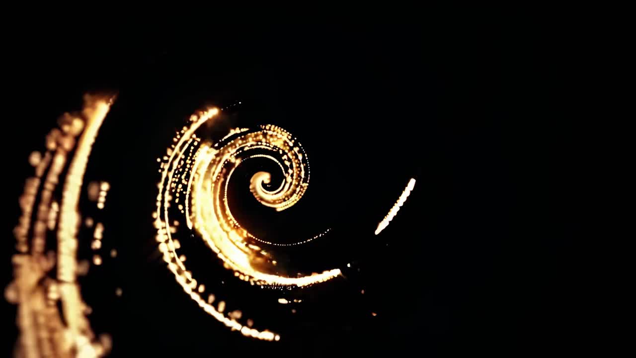 A mesmerizing spiral of golden lights captured from a top-down angle, creating a dynamic
