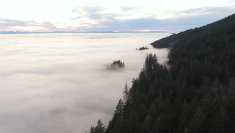 view of canadian nature mountain landscape covered in cloud and fog