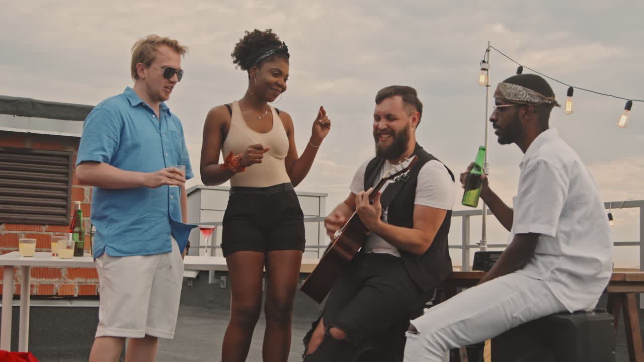 Group of Friends Having Party on Rooftop Terrace