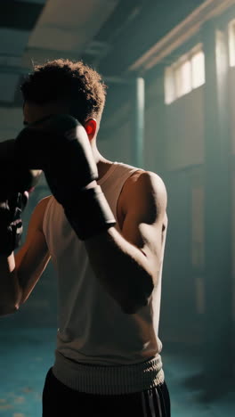young boxer training in a boxing gym