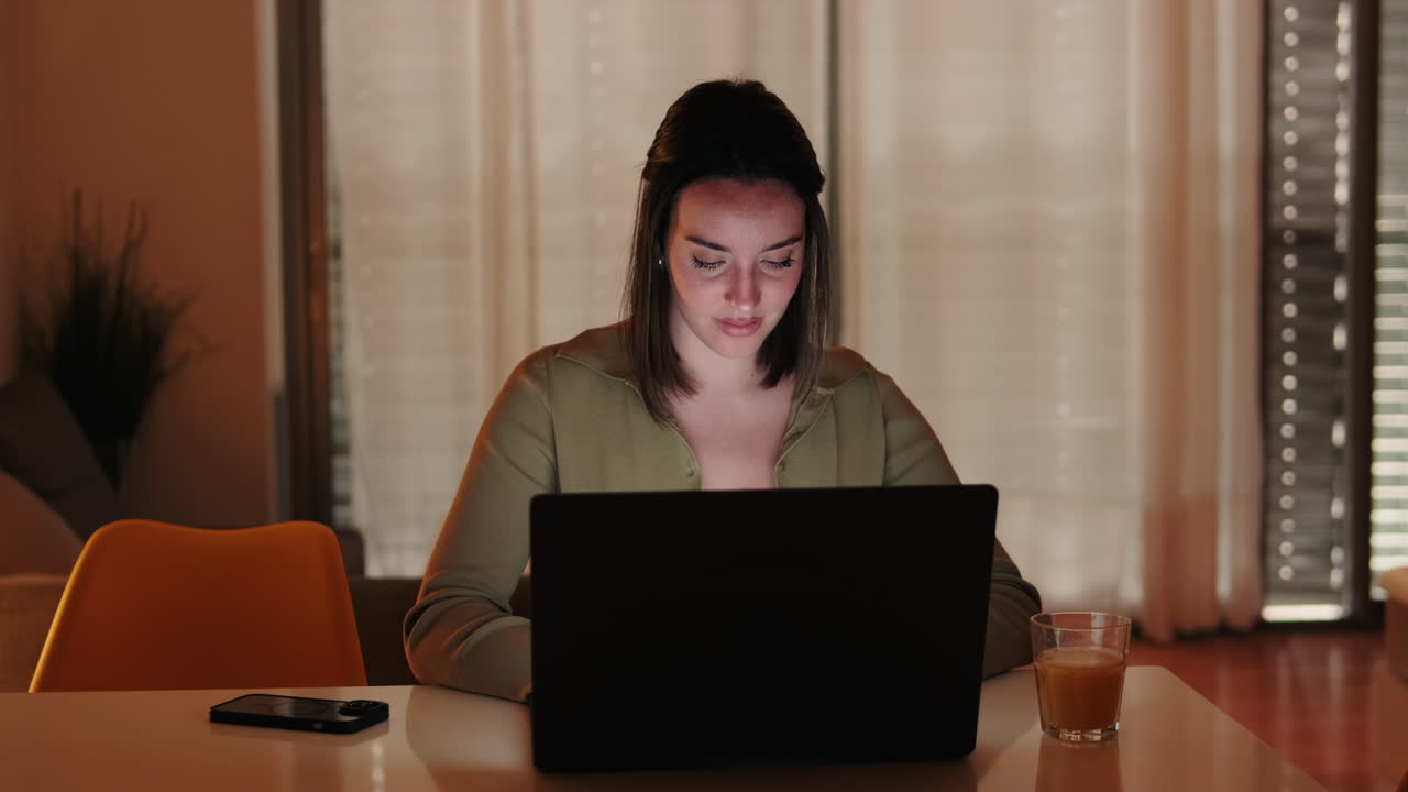 Portrait of CWoman Working From Home on Laptop at Night