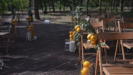 outdoor wedding ceremony decor with lemons and olive branches