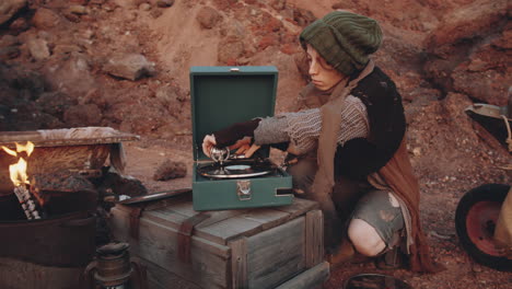 woman dancing to music on vinyl record player in dystopian world