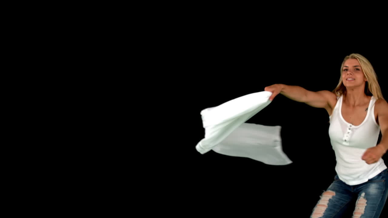 Pretty blonde spinning around on black