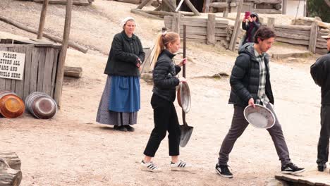 people panning for gold in historical setting