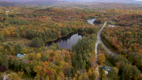 autumn foliage of new england region of america - aerial establishing static drone view