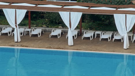 beautiful luxury umbrella and chair around outdoor swimming pool
