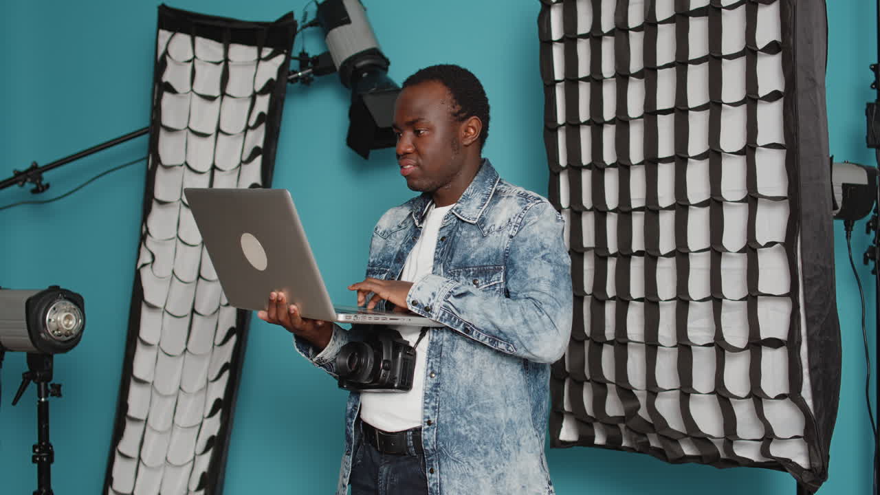 Young adult browsing internet on laptop to find photography inspiration