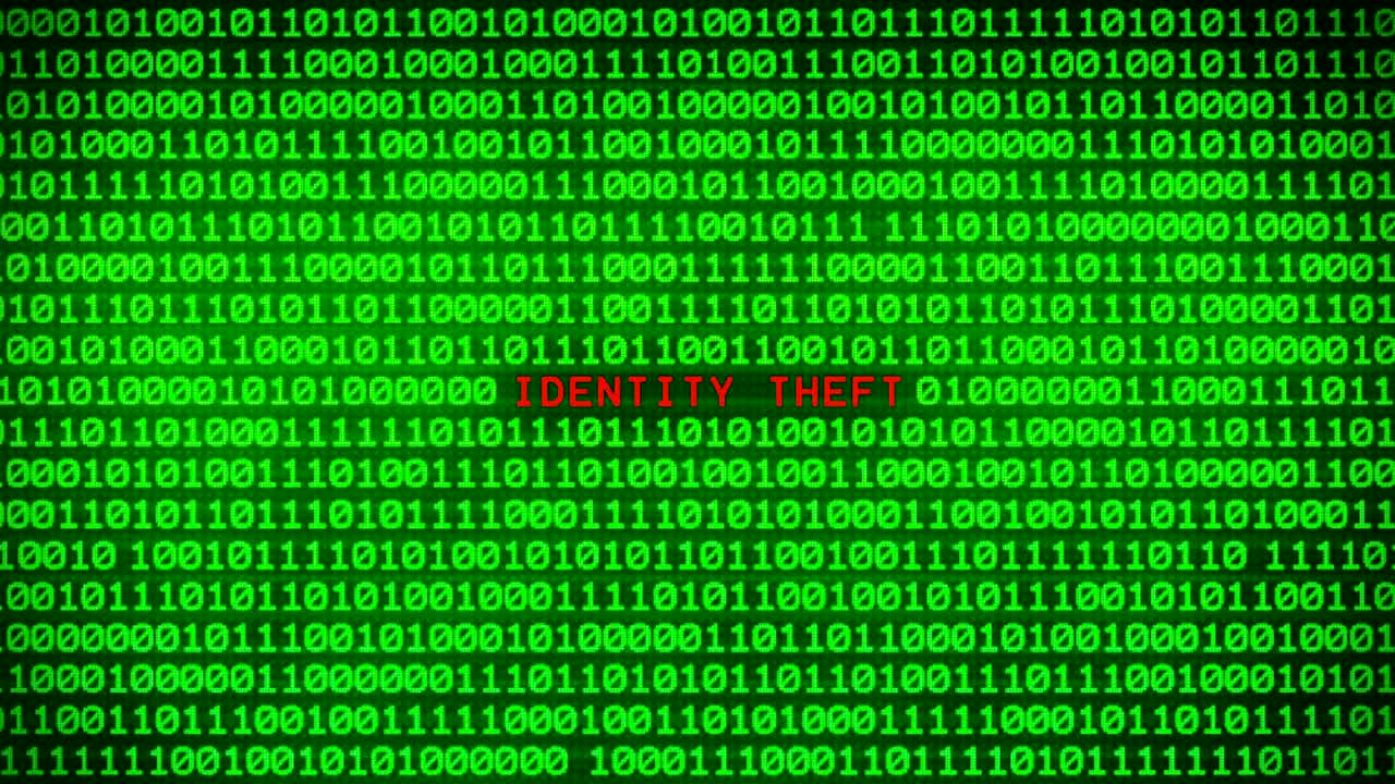IDENTITY THEFT Word Revealing on Wall of Green Binary Code  Between Random Binary Data Matrix Background
