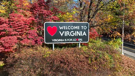 welcome to virginia state sign among colorful autumn foliage