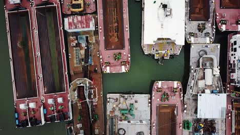 aerial view of abandoned cargo, transporting and tanker ships at a port, dock